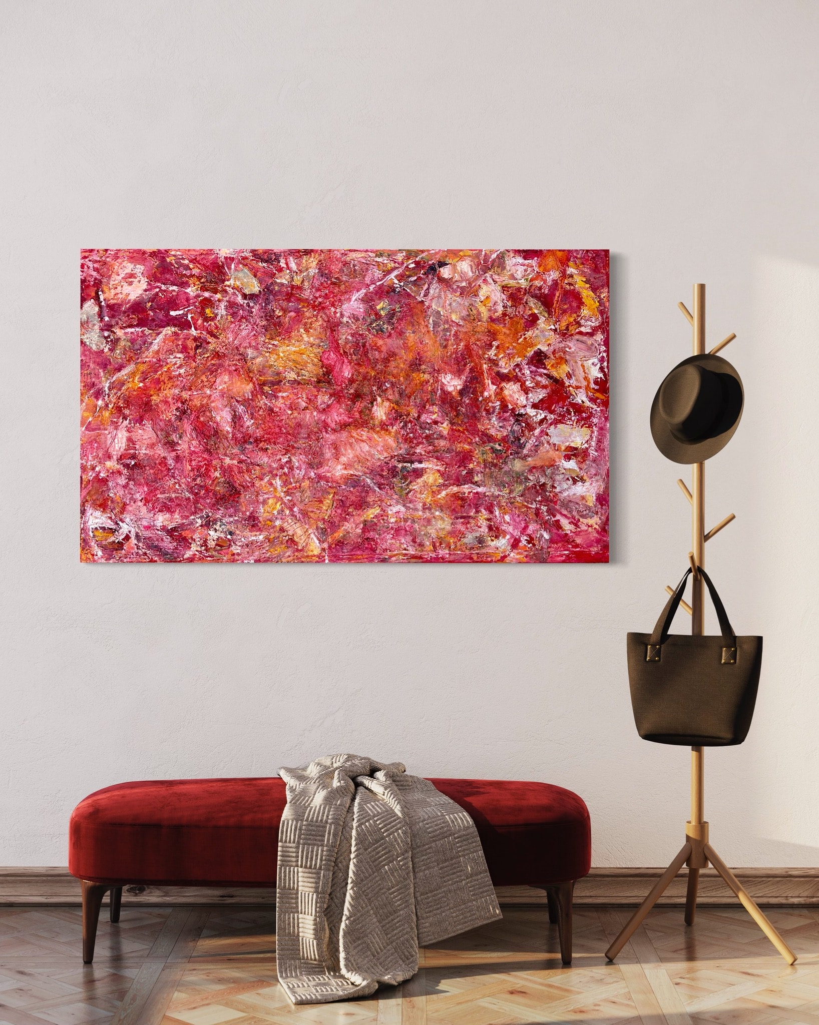 Abstract pink painting above red velvet bench