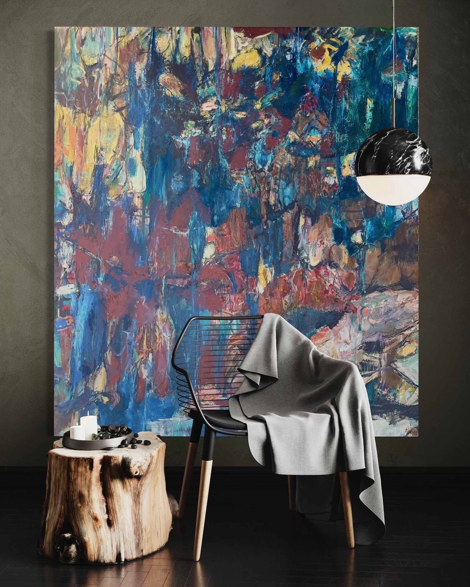 Large abstract painting with chair and pendant light